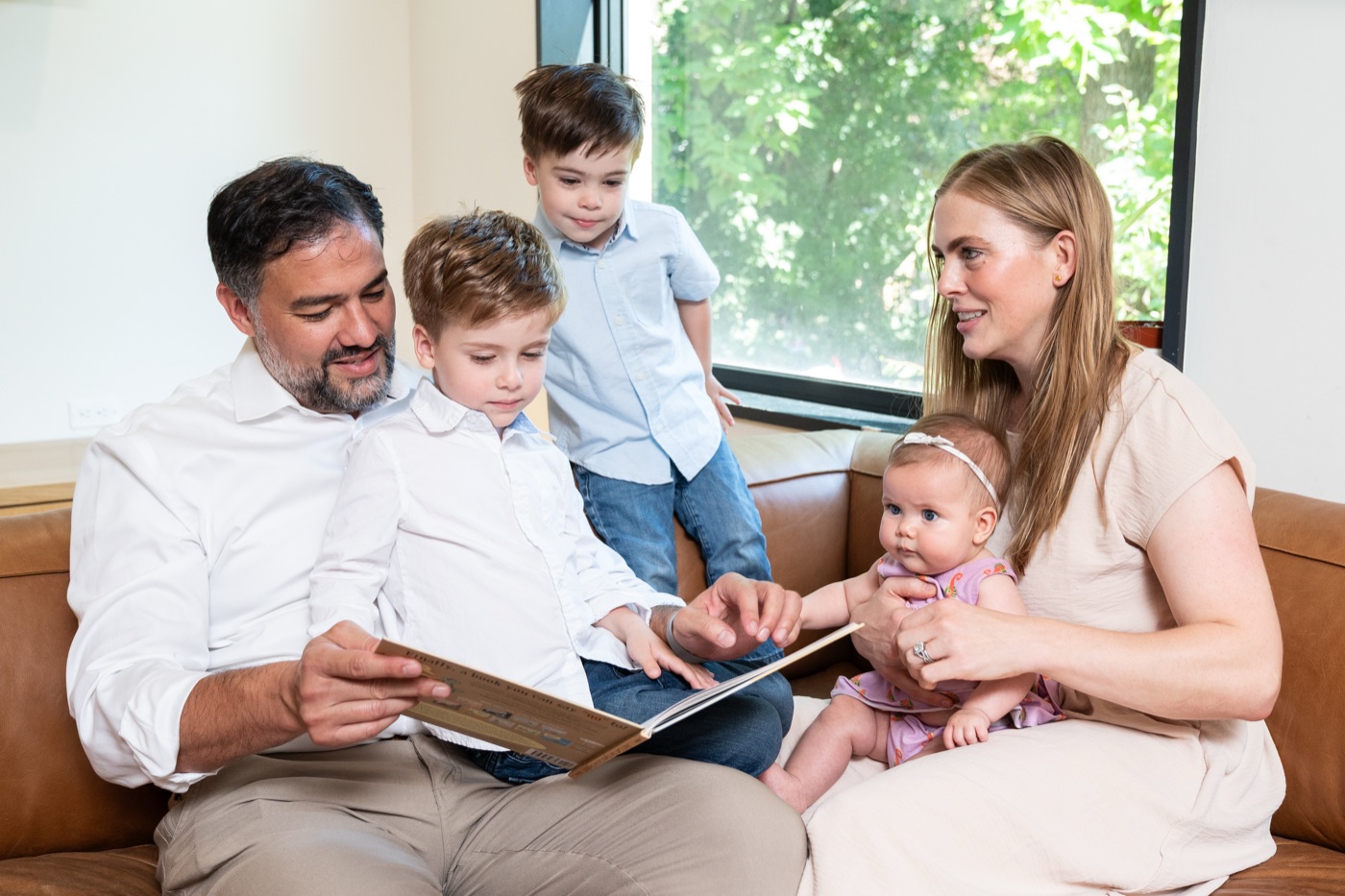 Daniel Tobón at home with his wife and their three children