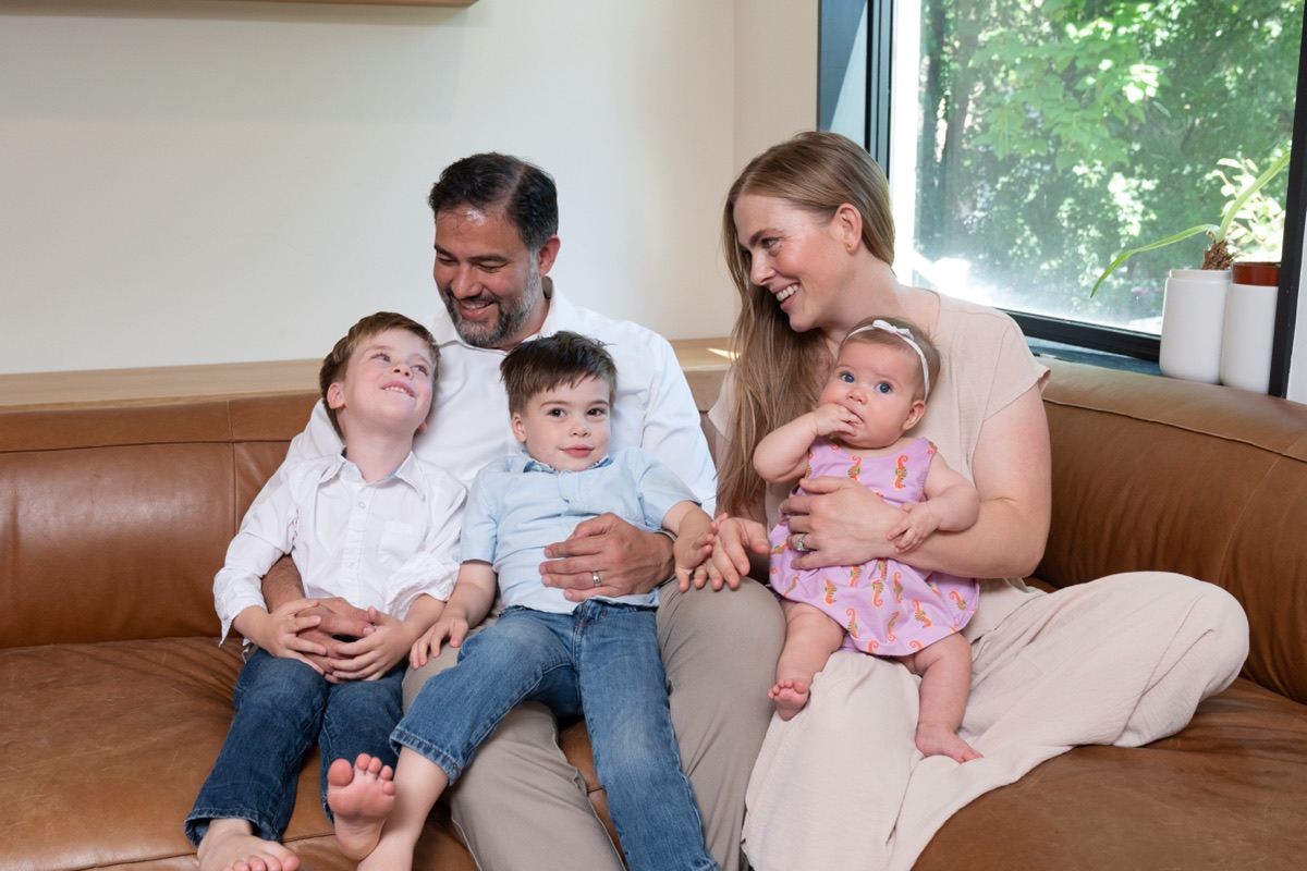 Daniel Tobón at home with his wife and three children